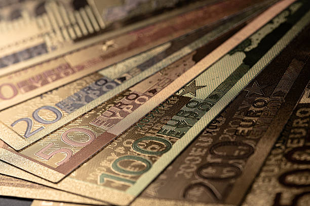 istock Stack of Various Euro Banknotes Arranged on a Black Background 2251226334