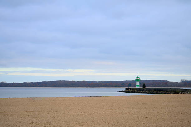 Lighthouse on a beach - Photomontage