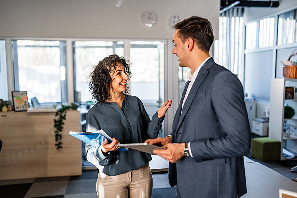 istock Business colleagues discussing project in modern office 2251229054