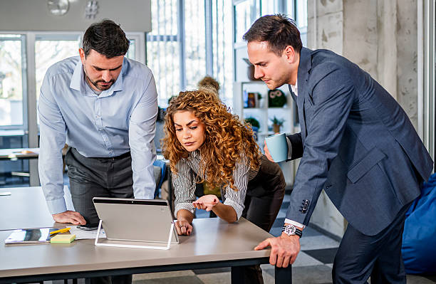 istock Business team colleagues collaborating on project with tablet computer 2251229125