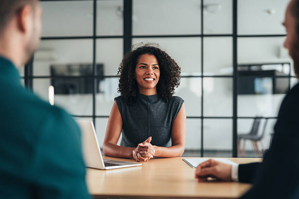istock Insurance agents consulting clients in modern office 2251230352