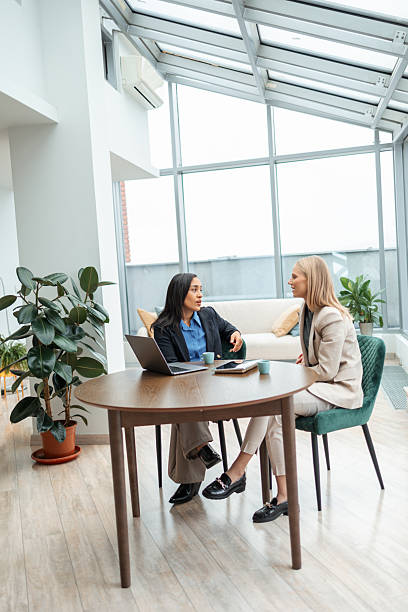 istock Diverse businesswomen discussing work at modern office meeting 2251231086