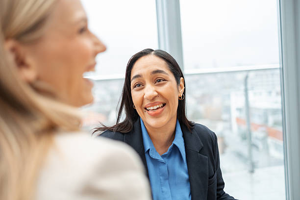 istock Professional businesswomen having an engaging conversation in an office 2251231129