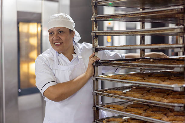 istock Baker pushing a car of freshly baked bread 2251231506