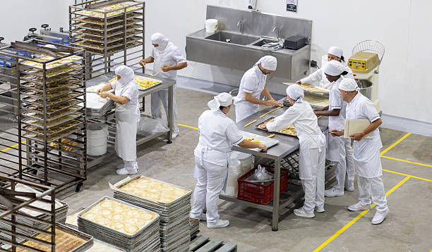 istock Group of employees baking bread at an industrial bakery 2251231569