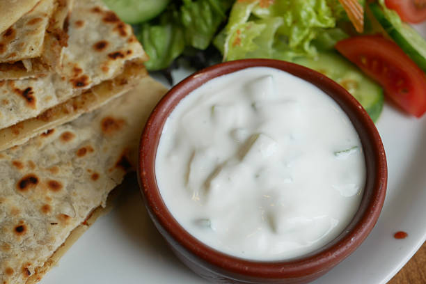 istock Delicious flatbread with yogurt dip and fresh salad 2251231764