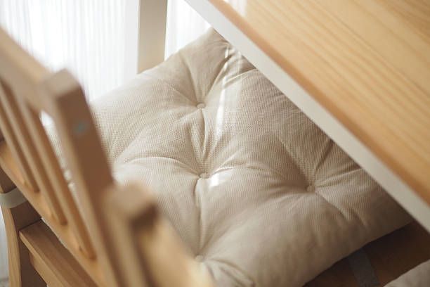 istock Comfortable chair cushion at a wooden table in natural light 2251233821