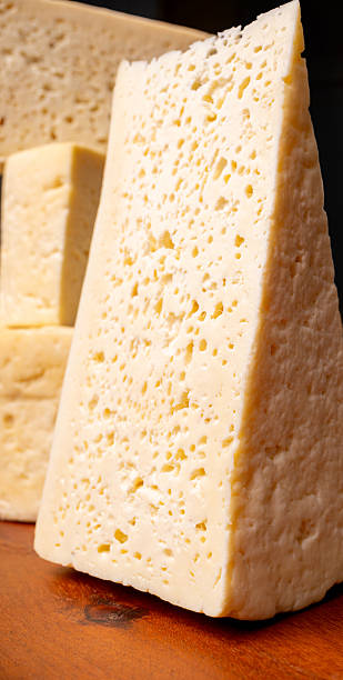 istock Semi-cured cheese, a wonderful semi-cured cheese from Minas Gerais on a rustic surface, selective focus. 2251235275