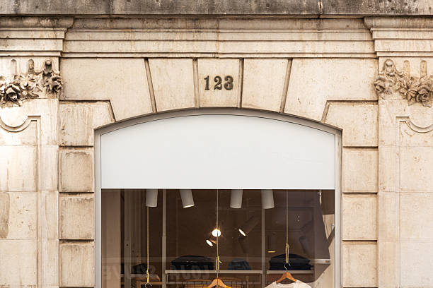 istock Blank white logo mock up in shop window 2251235456