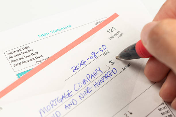 istock Writing a check for the mortgage payment 2251236286