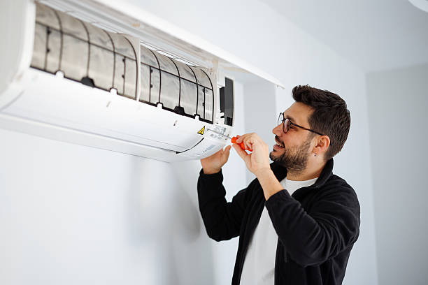 istock Setting a new air conditioner in the apartment 2251242354