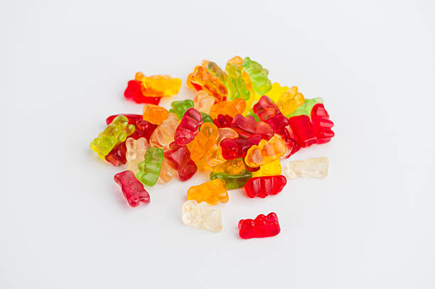 istock Colorful gummy bears arranged on a white surface 2251248432