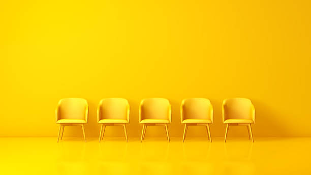 istock Five Yellow Chairs on Yellow Background 2251249570