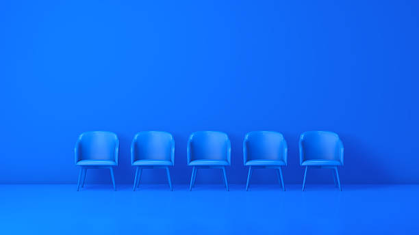 istock Five Blue Chairs on Monochrome Blue Background 2251250406