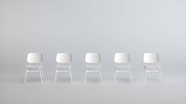 istock Five White Chairs in a Row on Minimal Background 2251250420