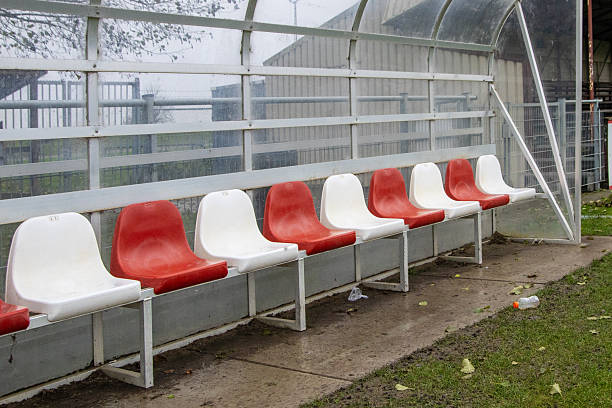 istock Modern football dugout with empty plastic seats 2251250609