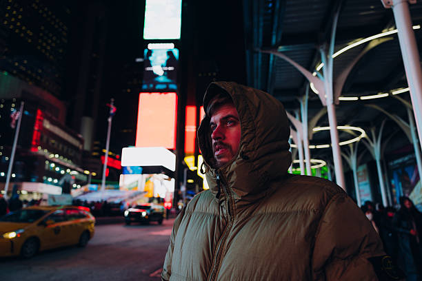istock Man Exploring Times Square in NYC During Night Time 2251251243