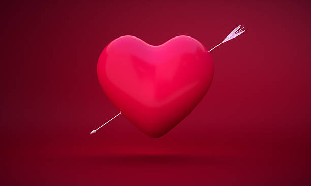 istock 3D Heart Pierced by Arrow on Red Background 2251252060