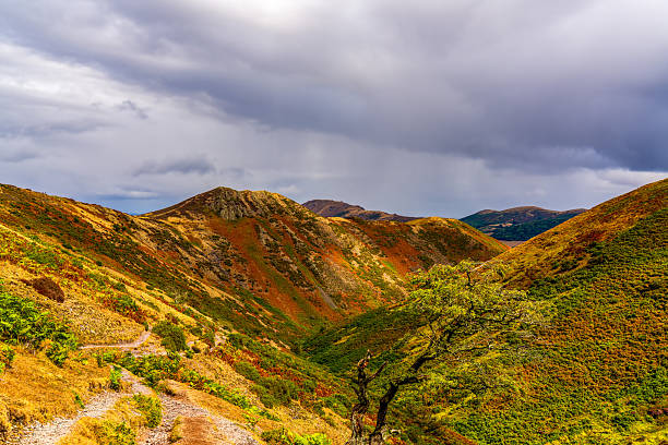 Dramatic Storm Clouds Over Colourful Rolling Hills in an English Mountain Landscape