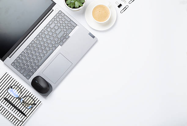 istock Flat lay with laptop, notebook and cup of coffee on color background. Office workplace 2251253941