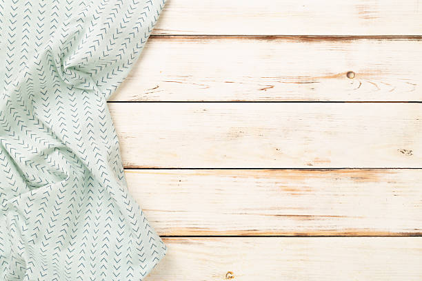 istock Kitchen napkin on wooden background, top view 2251254745