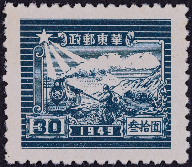 Field worker bending over and harvesting rice on a old postage stamp from French Indochina.