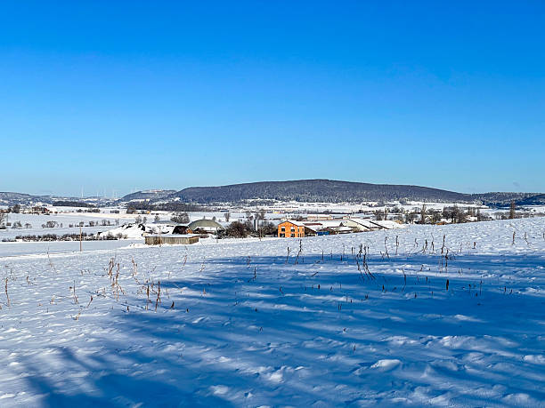 istock Winter snowy rural landscape with bright blue sky 2251255727