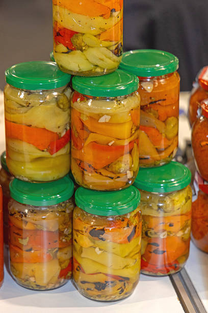 Stacks of Masson Jars Pickled Mix Peppers in Brine Food Preserving