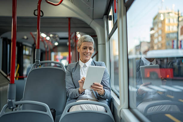 istock Businesswoman commuting on bus using digital tablet 2251255975
