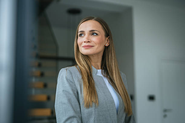 istock Smiling businesswoman looking away with confident expression 2251256070