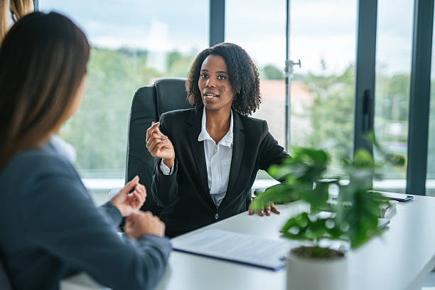 istock Diverse businesswomen collaborating and discussing ideas in modern office 2251256224