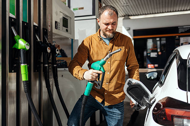 istock A man refueling a car at a gas station 2251256425