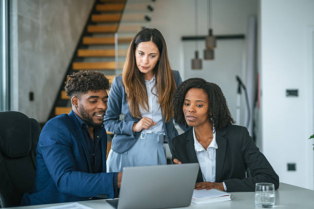 istock Diverse start up business team collaborating on laptop strategy 2251256853