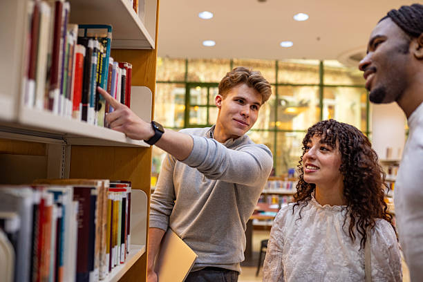 istock Portrait of college students in a library 2251261337
