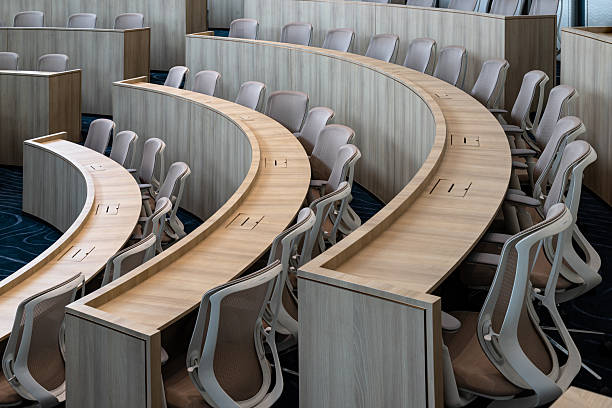 istock Characterized by its distinctly modern, minimalist design and semi-circular, tiered seating, this auditorium provides an ideal setting for focused presentations. 2251263406