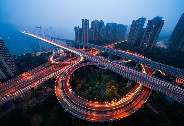 istock Night Light Trails Spiraling Through Huangjuewan Interchange, Chongqing, China 2251263827