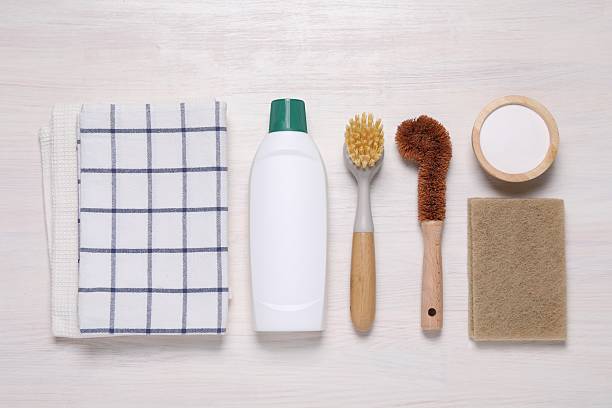 istock Flat lay composition with different cleaning supplies on light wooden background 2251265305