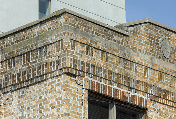istock deep crack in brick building facade (crumbling infrastructure dangerous home) danger to pedestrians red brickwork repair needed brooklyn new york apartment house flats close up terra cotta cement 2251265474