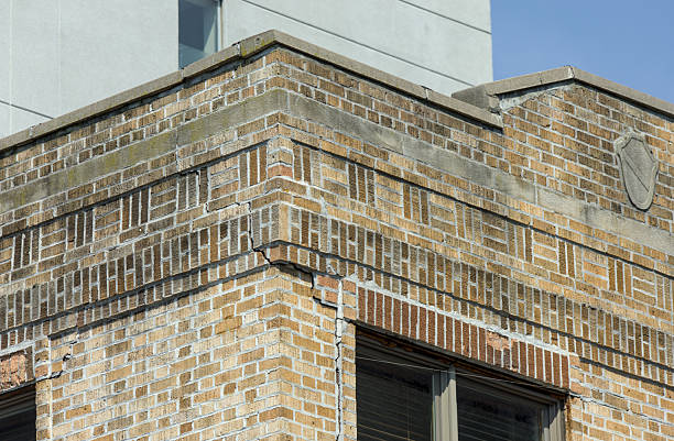istock deep crack in brick building facade (crumbling infrastructure dangerous home) danger to pedestrians red brickwork repair needed brooklyn new york apartment house flats close up terra cotta cement 2251265481