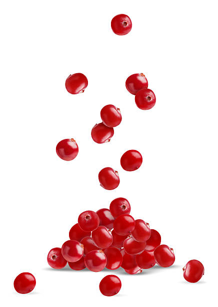 istock Fresh red cranberries falling onto pile against white background 2251271044