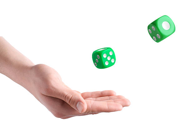istock Man throwing green dice on white background, closeup 2251273090