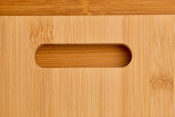 istock Close-up of bamboo cutting board with oval cutout handle 2251273982