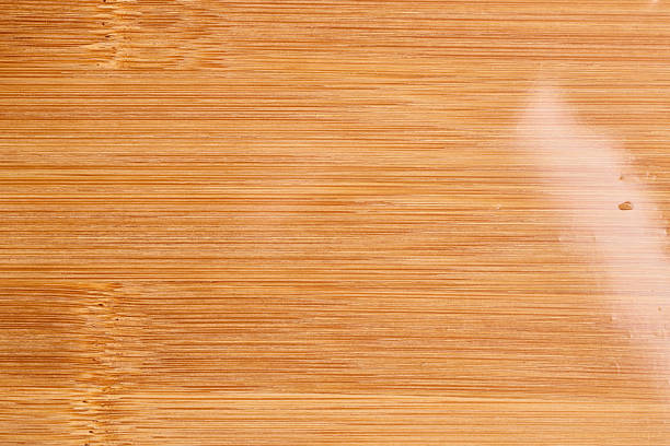 istock Smooth light brown wooden texture with subtle grain and natural finish 2251273987