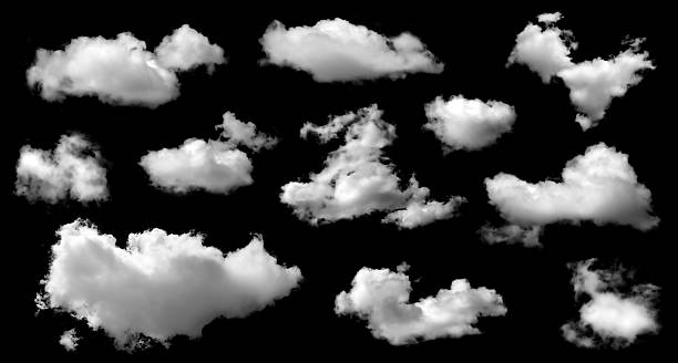 istock A collection of white fluffy clouds isolated on a black background. Abstract cloud, dark grey storm condensation. Concept effect design smoke fog 2251274328