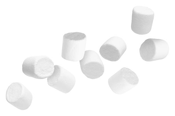 istock Many yummy marshmallows flying on white background 2251275582