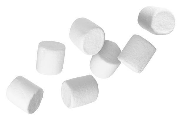istock Many yummy marshmallows flying on white background 2251276316
