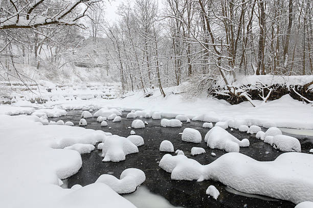 istock Snow-Covered Rocks in Creek 2251276512
