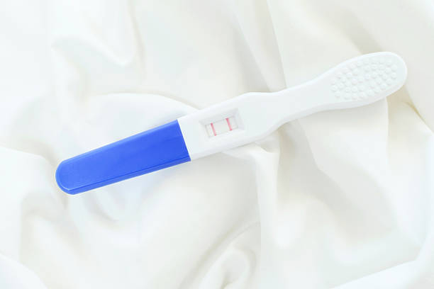 Woman asian taking a pregnancy test.