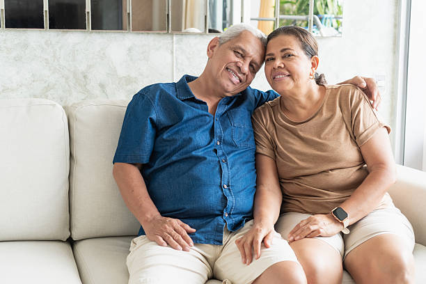 istock Senior couple sharing true love on sofa at home 2251280212