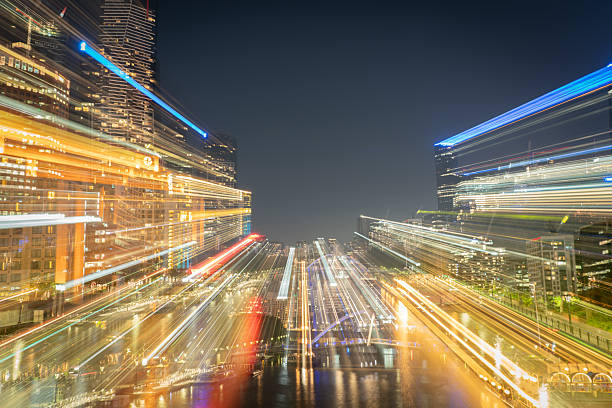 Melbourne Australia - March 9 2020; Hectic city at night in zoom blur buildings, lights and reflections iblur abstract.